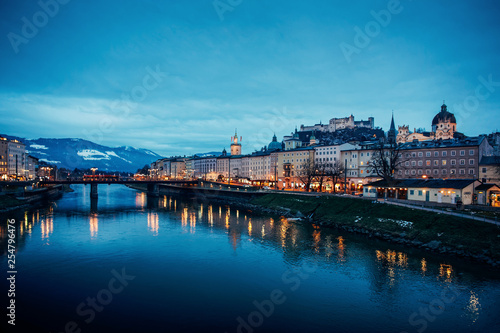 Old city with Hohensalzburg castle and Salzach River Salzburg evening