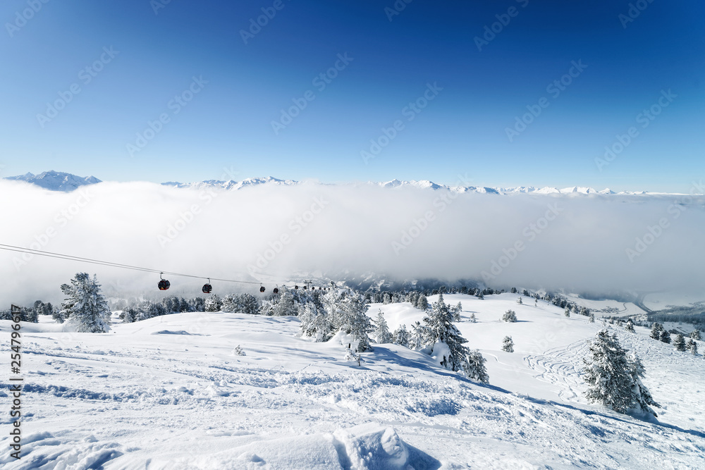 Ski lifts and Clouds Zillertal Arena ski resort Austria