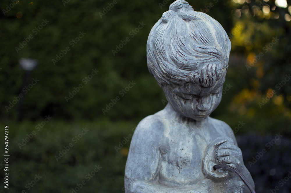 Obraz premium Old weathered garden statue.