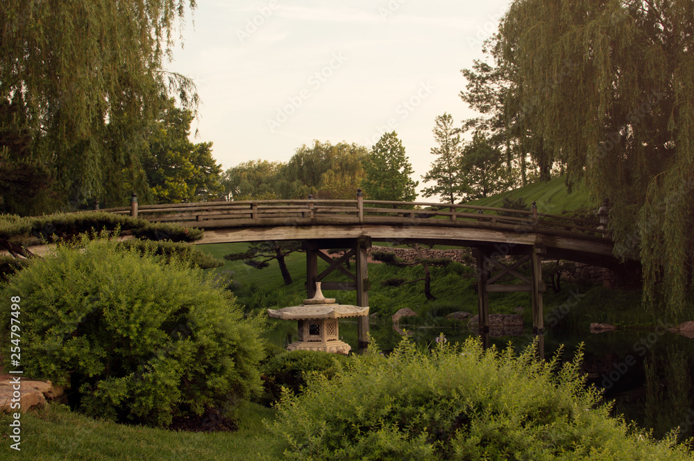 Sunset on bridge over japanese garden. Sunset on bridge over japanese garden.