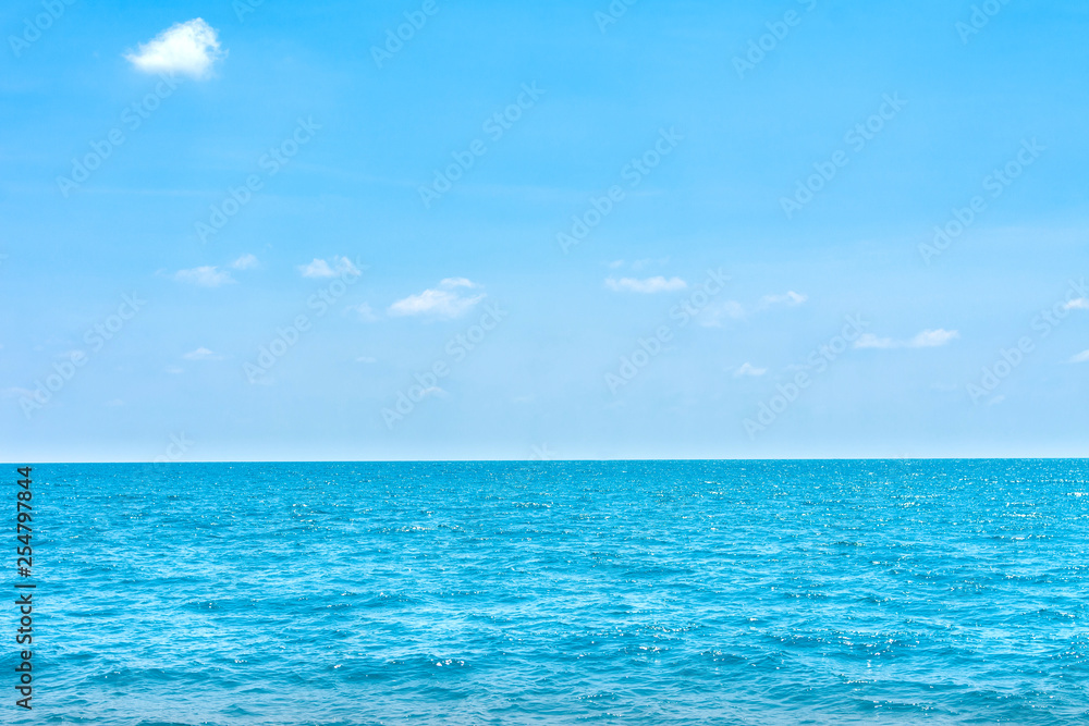Natural tropical sea surface summer with blue sky background. Travel tropical Ocean sea. Natural tropical sea surface summer with blue sky background. Travel tropical Ocean sea.