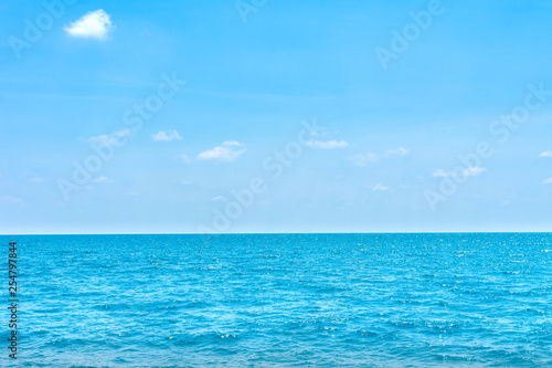 Natural tropical sea surface summer with blue sky background. Travel tropical Ocean sea.