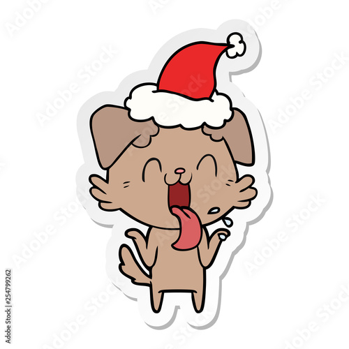 sticker cartoon of a panting dog shrugging shoulders wearing santa hat