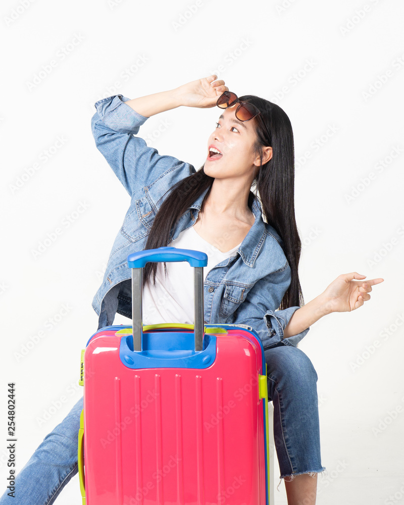 Traveler tourist woman in summer casual clothes.Asian Smiling woman wearing sun glasses.Passenger traveling abroad to travel on white background. Traveler tourist woman in summer casual clothes.Asian Smiling woman wearing sun glasses.Passenger traveling abroad to travel on white background.