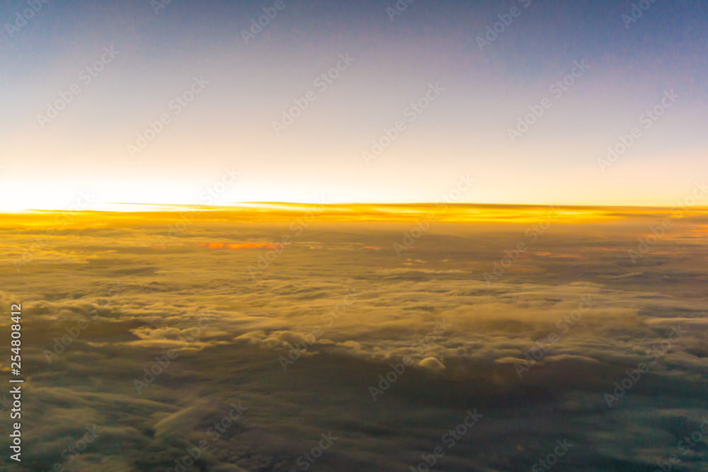 Colorful sunrise sky with cloud above view from airplane