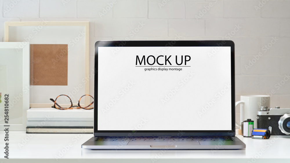 Fototapeta premium Stylish workspace with mock up laptop computer..