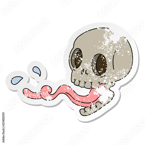 distressed sticker of a quirky hand drawn cartoon skull with tongue