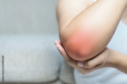 Canvas Print Bone pain or muscle pain around the elbow.