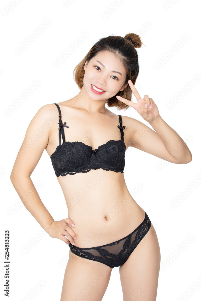 Fototapeta premium Chinese woman posing in panties and bra on white background