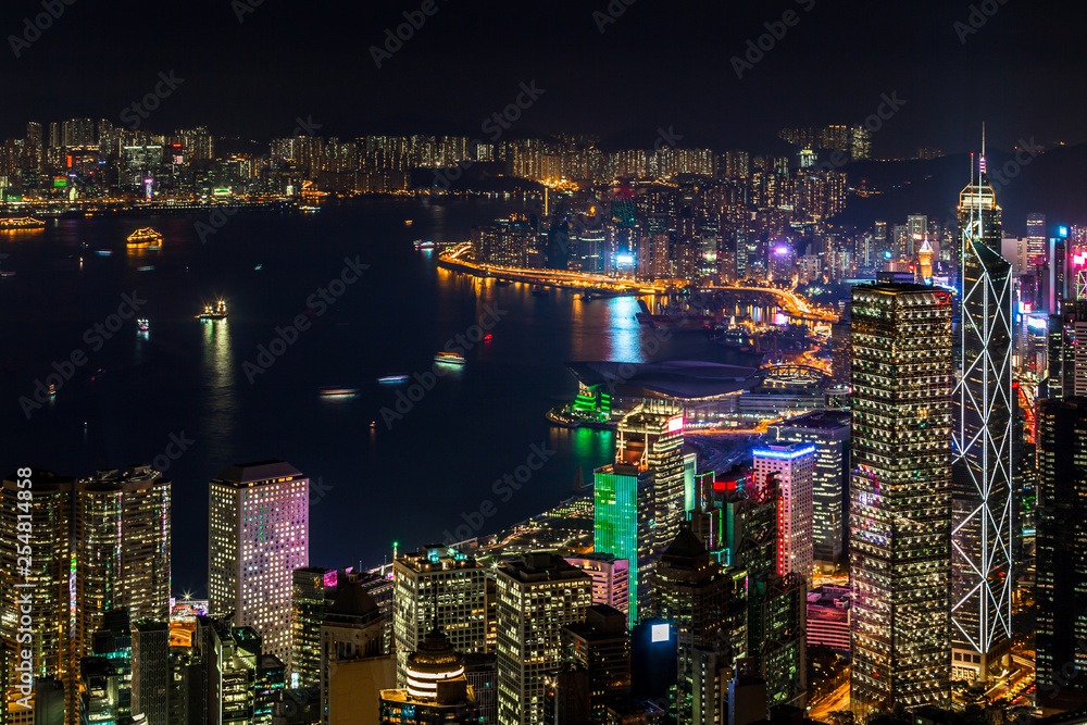 Naklejka premium Hong Kong city view from The Peak at night, Victoria Harbor view from Victoria Peak at night, Hong Kong.