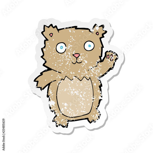 retro distressed sticker of a cartoon waving teddy bear