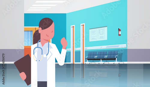 female doctor with stethoscope and clipboard standing in hospital clinic corridor consultation and diagnosis healthcare concept horizontal portrait flat