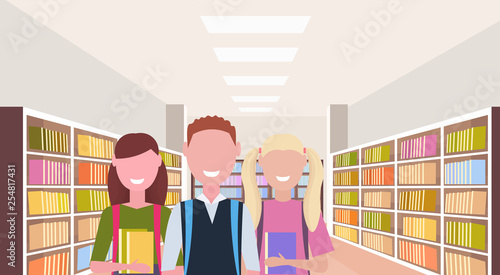 students holding books happy pupils standing near bookshelves modern library interior reading education knowledge concept portrait flat horizontal