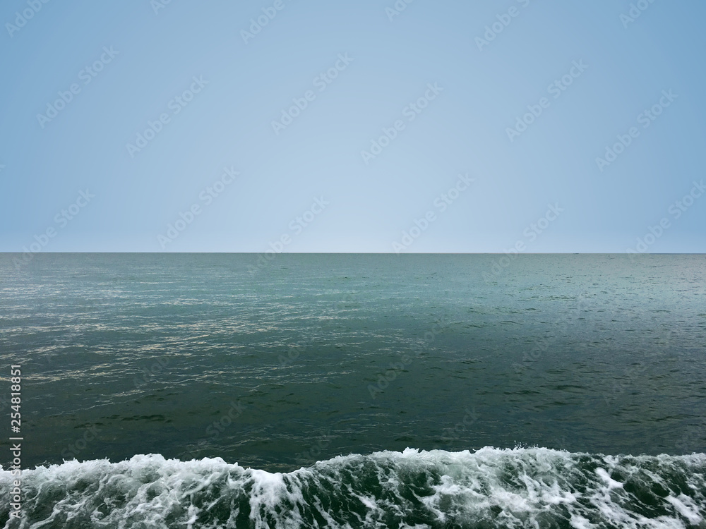 Obraz premium Beautiful calm sea wave under clear sky background