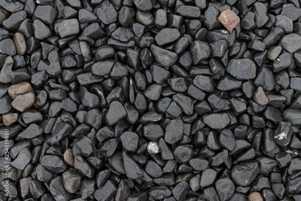 Black pebble stone background texture Black pebble stone background texture
