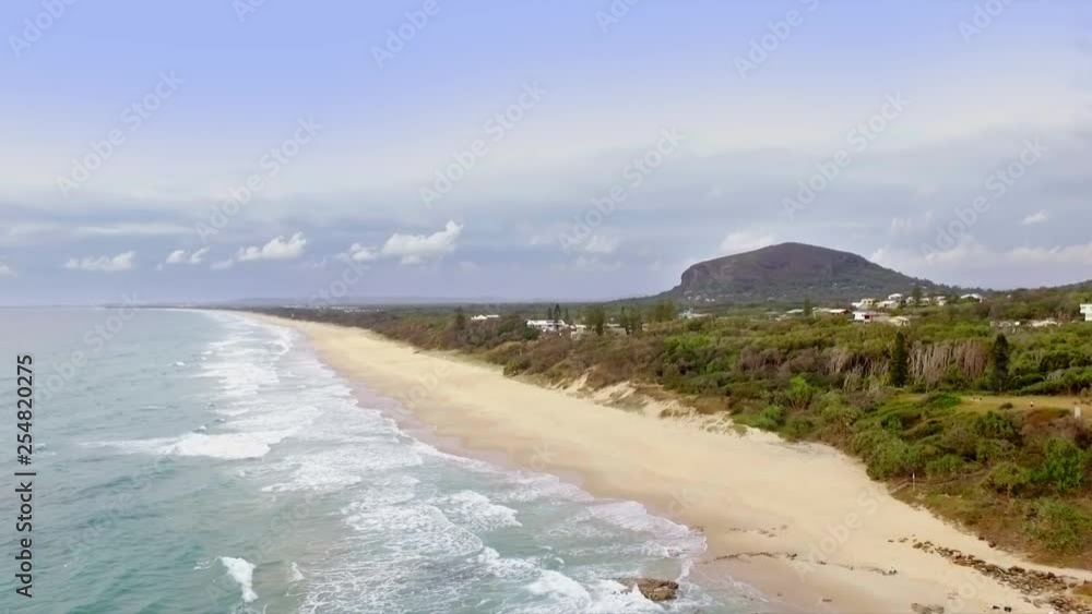 Aerial drone slow travelling shot looking South along the coast towards Mt Coolum Aerial drone slow travelling shot looking South along the coast towards Mt Coolum