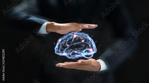 human hand holding brain, Artificial Intelligence, AI Technology, thinking concept.