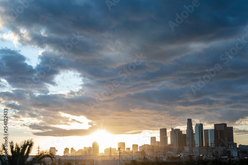 Gorgeous panoramic view of DTLA downtown Los Angeles with the sun setting behind skyscrapers