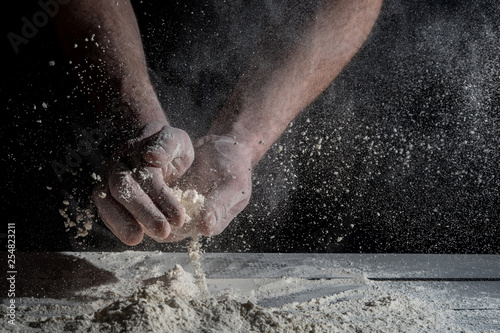 Man prepares a meal of flour