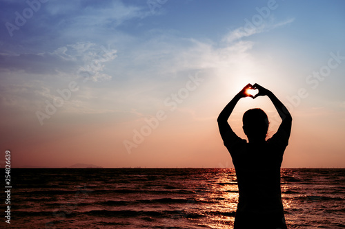 silhouette of young woman at sunset