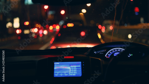 people driving car on night road, traffic jam in the city