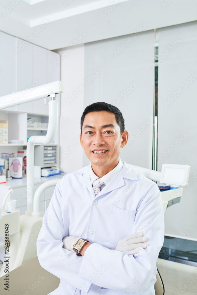 Professional dentist in dental clinic