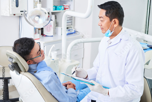 Patient has a consultation in dental clinic