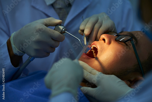 Patient treating his teeth