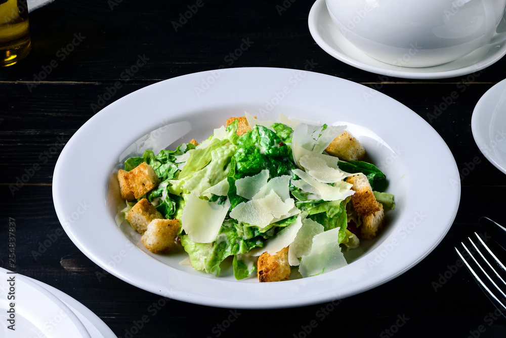 fresh vegetable salad on a black table in cafe restaurant