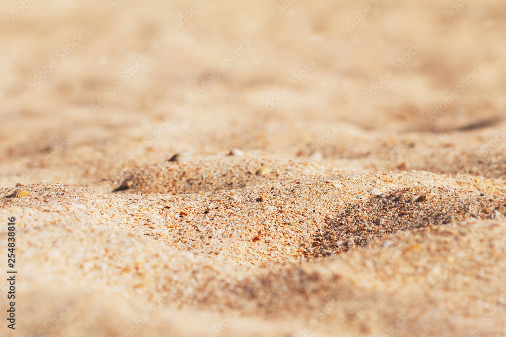 Golden sand background, tropical beach, selective focus Golden sand background, tropical beach, selective focus