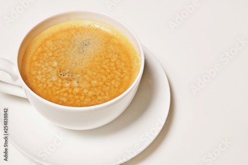 Top table of hot cup of coffee on white background with copy space.