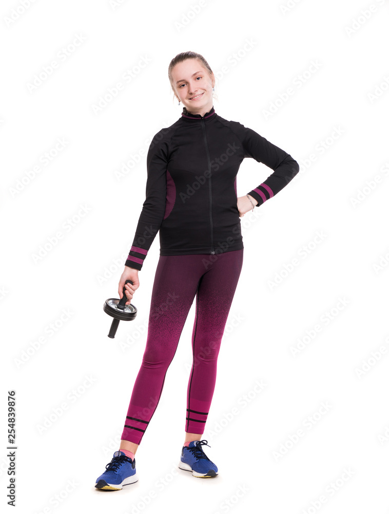 Sports and healthcare concept. Smiling teen girl in sportswear working out in studio Sports and healthcare concept. Smiling teen girl in sportswear working out in studio