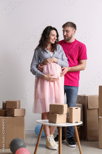 Happy pregnant couple with ...