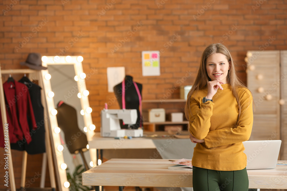 Portrait of beautiful female business owner in atelier Portrait of beautiful female business owner in atelier