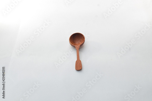 a half round spoon of wood