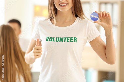 Young female volunteer with...