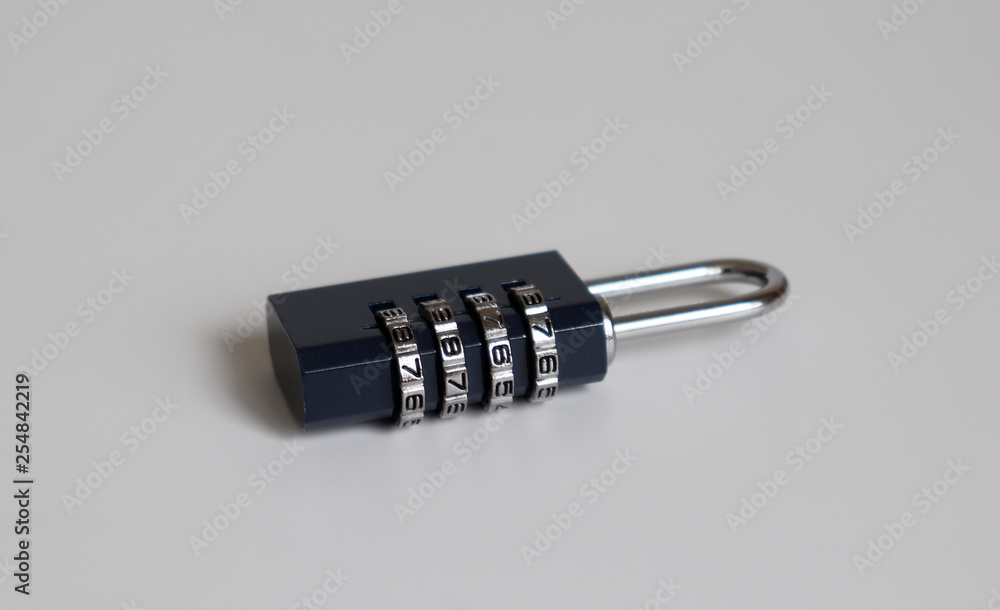 A locked combination lock on the white background. A locked combination lock on the white background.