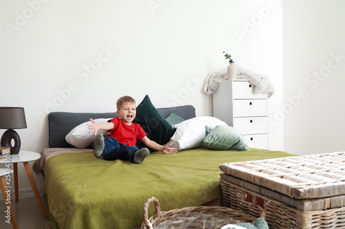 Happy little boy playing on...