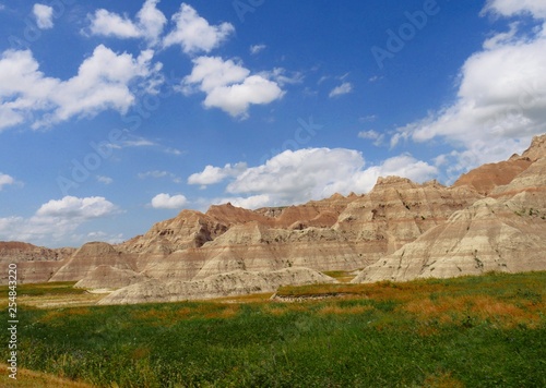 Breathtaking view of the Badlands National Park in South Dakota, USA, with gorgeous clouds in the skies.
