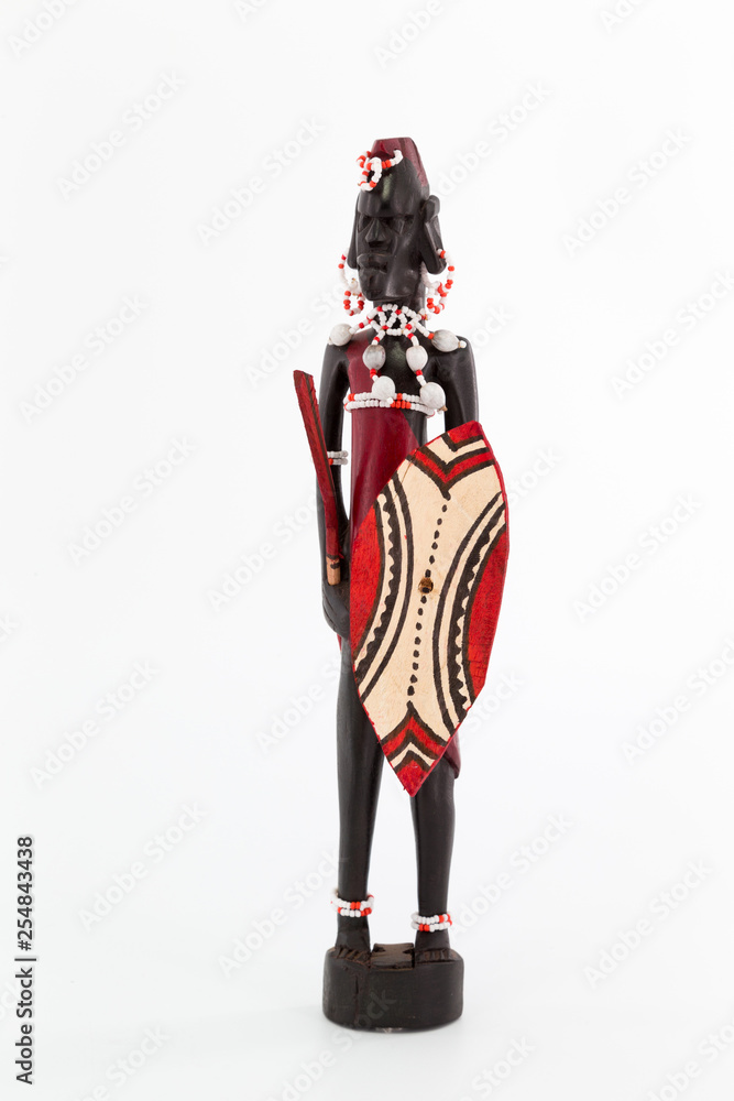 Wooden figure of a Maasai man on white background