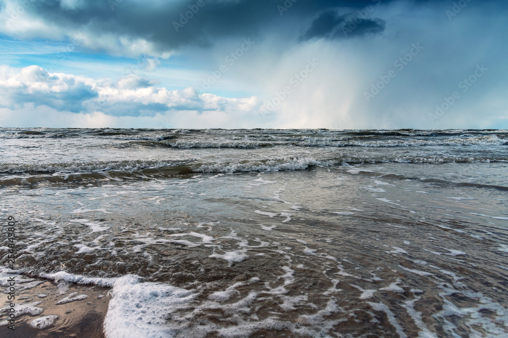 Fototapeta premium Clouds over Baltic sea, Liepaja, Latvia.