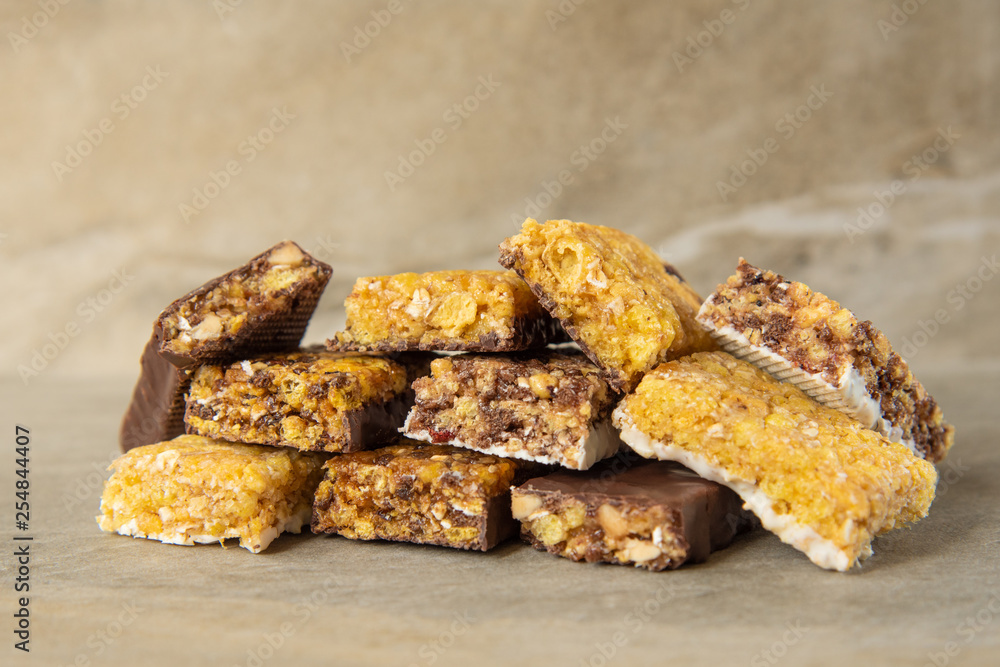 Various muesli bars on marble stone background Various muesli bars on marble stone background