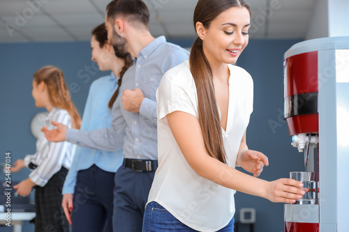Colleagues drinking water f...
