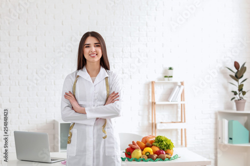Portrait of female nutritionist in her office photo