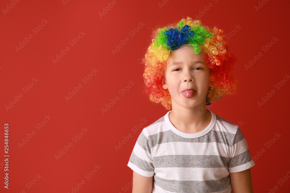 Little boy in funny disguise on color background. April fools' day celebration Little boy in funny disguise on color background. April fools' day celebration