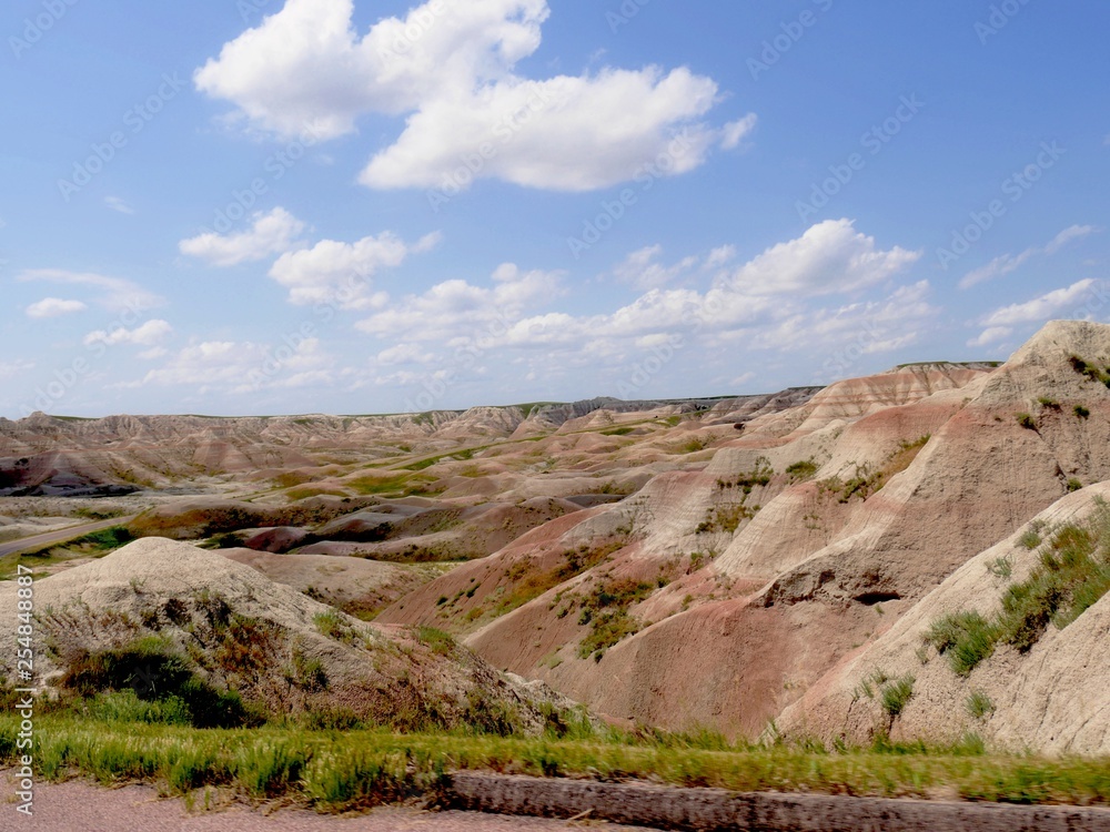 Wide shot of layered rock formations at th e Badlands National Park in South Dakota, USA.