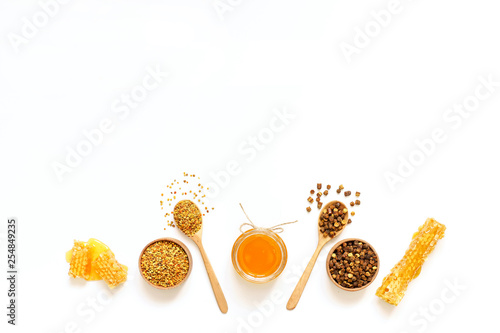 Parchment, pollen, honey bee on a white background.