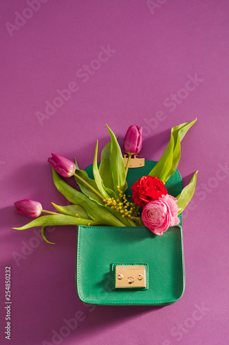 Flowers inside a woman's purse 