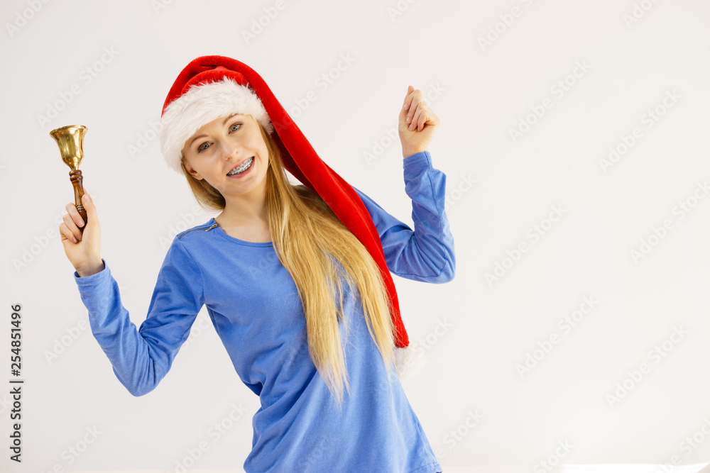 Christmas woman holding bell.