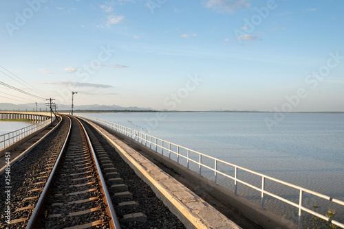 Landscape View of  Train crossing Pasak Chonlasit Dam. Reservoir for agriculture at Lopburi,Thailand © fototrips